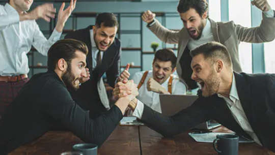 Does testosterone drive success in men? men sitting around a table
