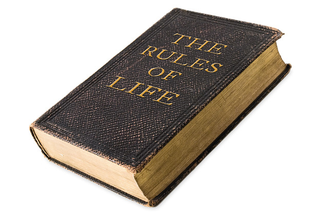 Our Internal Rule Book: Friend or Foe? an old book entitled The Rules of Life